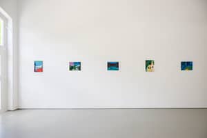 Contemporary art gallery installation in Galerie Onrust in 2022, featuring vibrant paintings by Axel Linderholm on white walls.