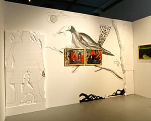 Art installation with dark atmospheric paintings, drawings of birds and a styrofoam sculpture of a man in the Centre for Contemporary Art Vilnius.