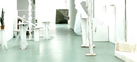 Contemporary art gallery installation in W139, featuring white abstract sculptures. The white room resembles an artist studio: Studio Double V, or Studio Blind Matisse.